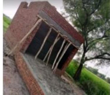 Water Plant 2 with brick walls up and timber shuttering in place, fields behind